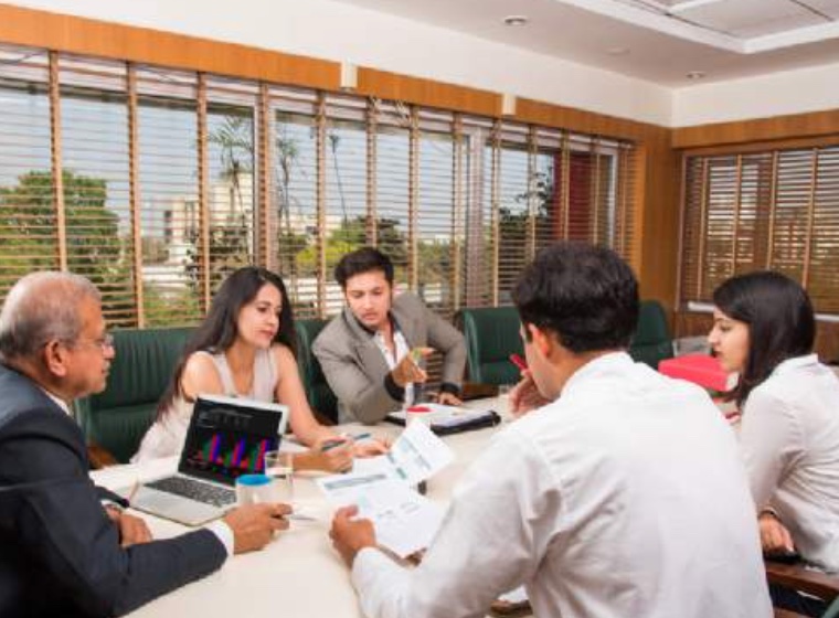 Agents and partners around a meeting table